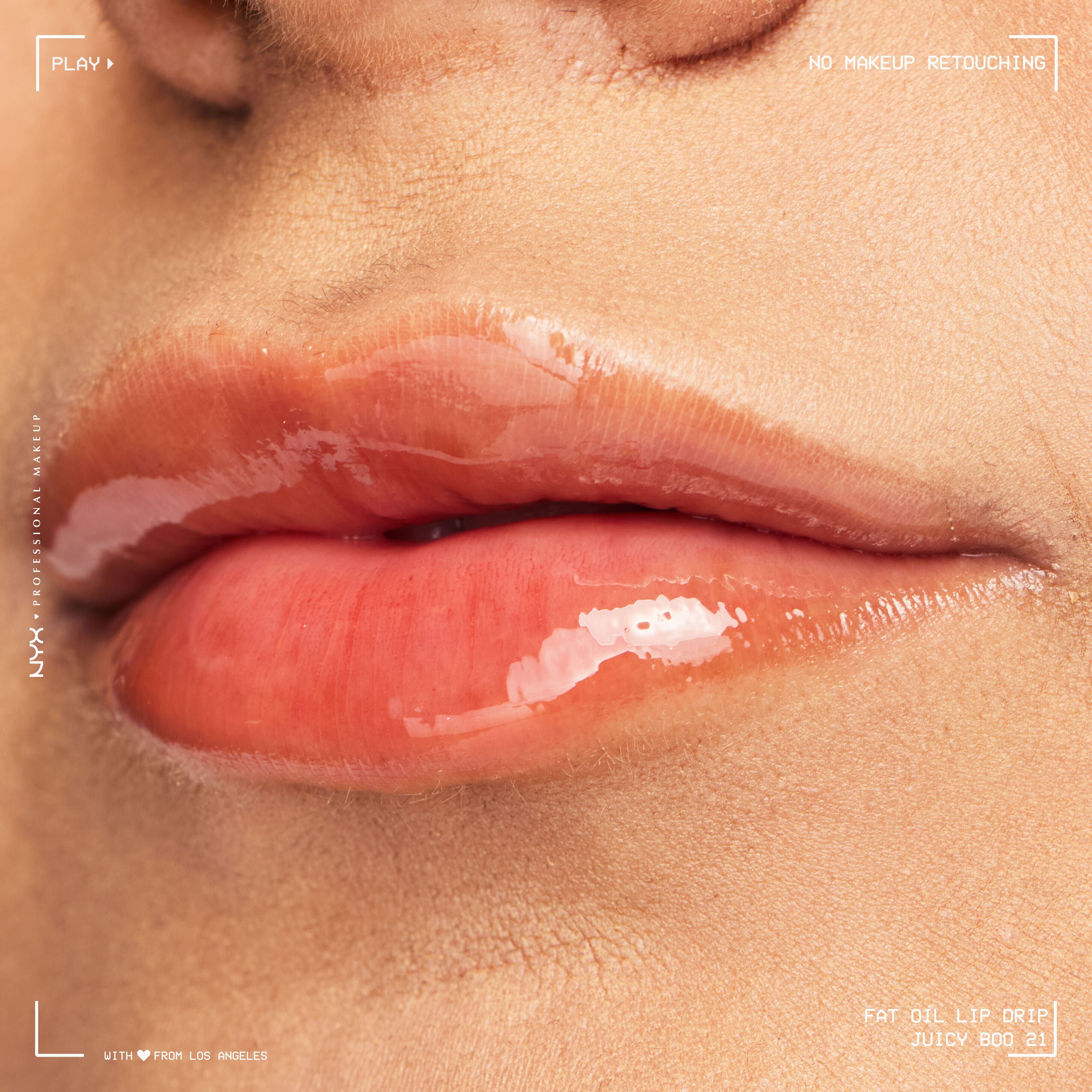Close-up of glossy lips on medium skin tone wearing NYX Professional Makeup Fat Oil Lip Drip in Juicy Boo, showing rich shine, smooth hydration, and natural lip texture without retouching.