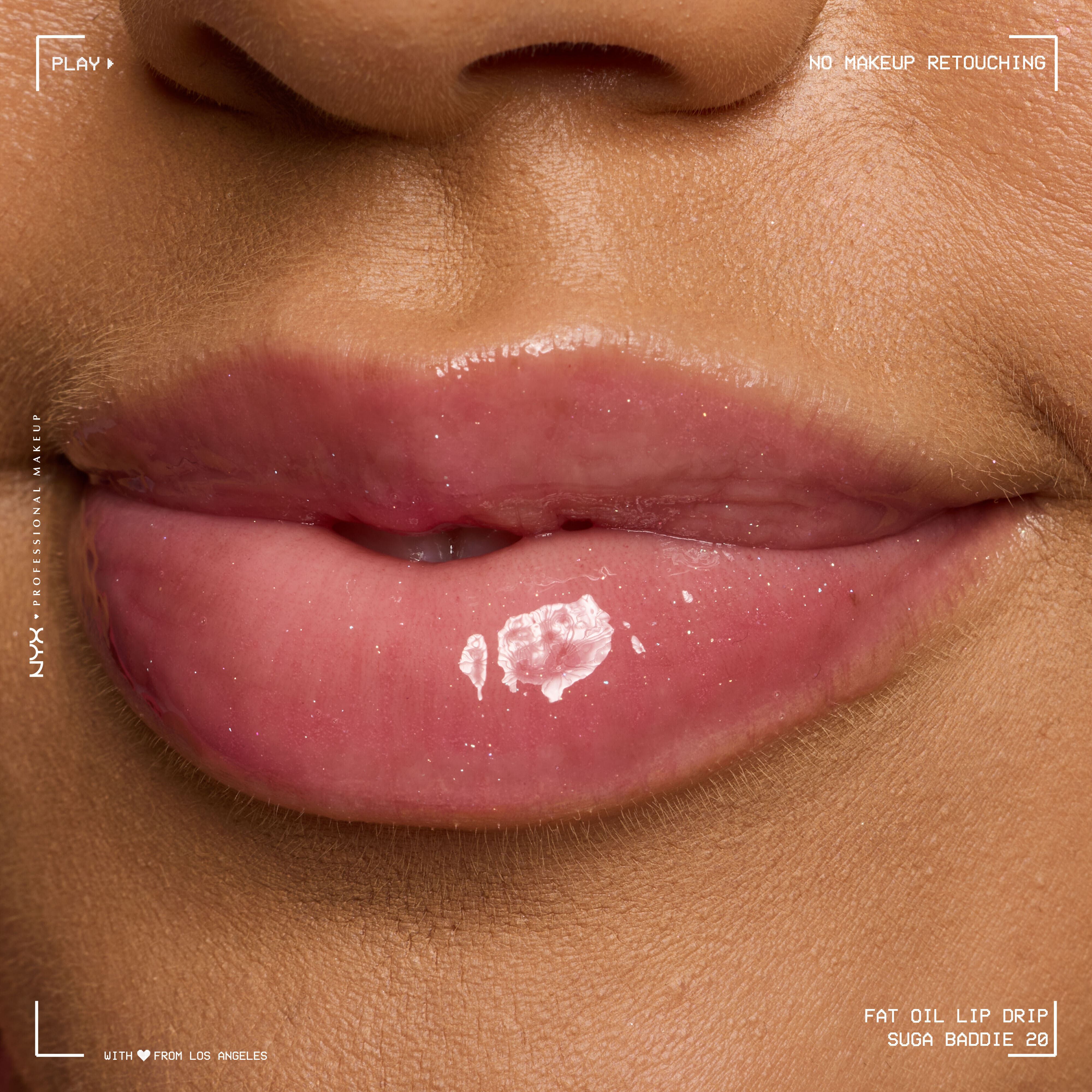 Close-up of glossy pink lips wearing Fat Oil Lip Drip in shade Suga Baddie, showing high-shine finish and smooth hydration on medium skin tone.