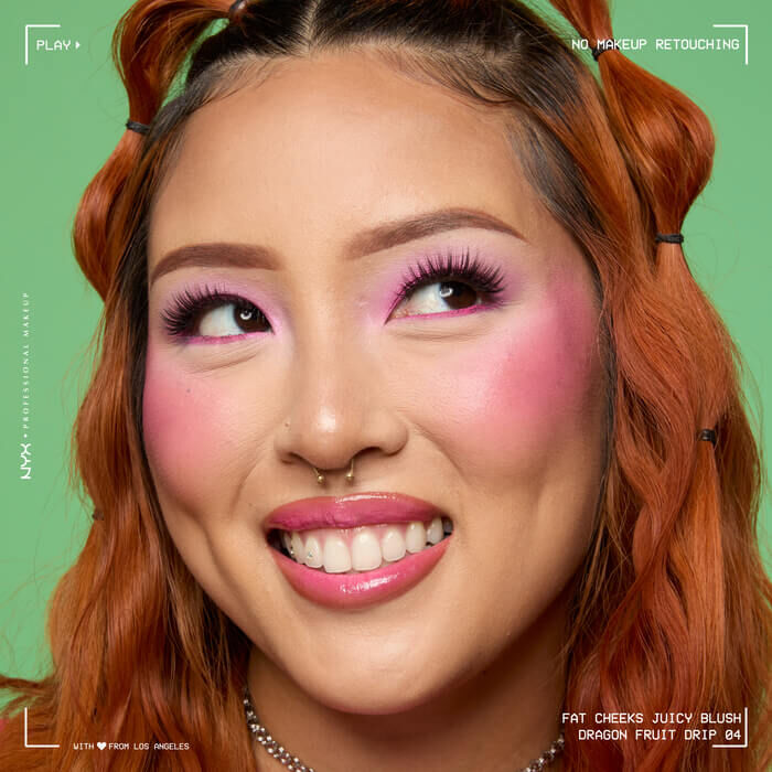 Model with pink makeup look wearing Fat Cheeks Juicy Blush liquid blush in shade Dragon Fruit Drip