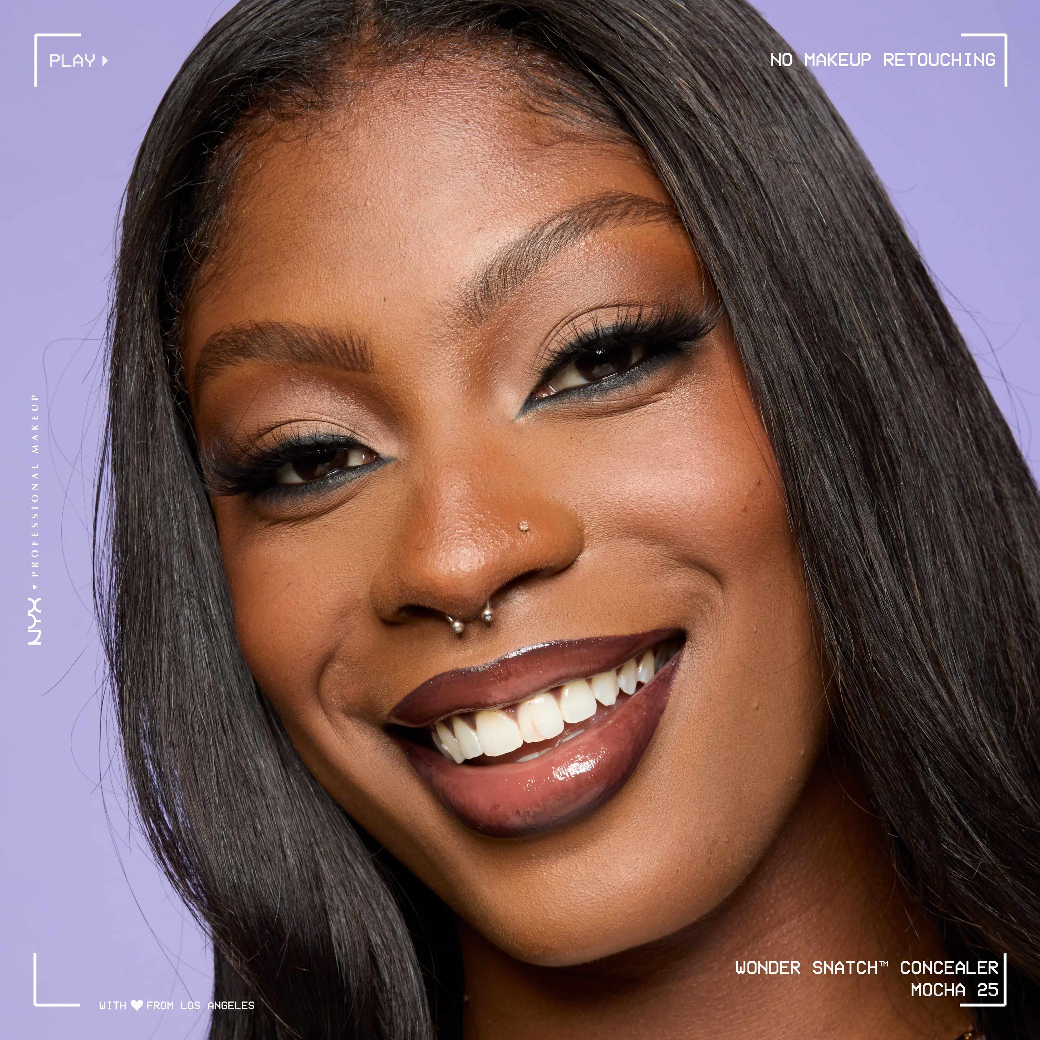 Close-up of model wearing Wonder Snatch(TM) Concealer, with brightened under-eyes, smooth-looking skin, and a natural finish.