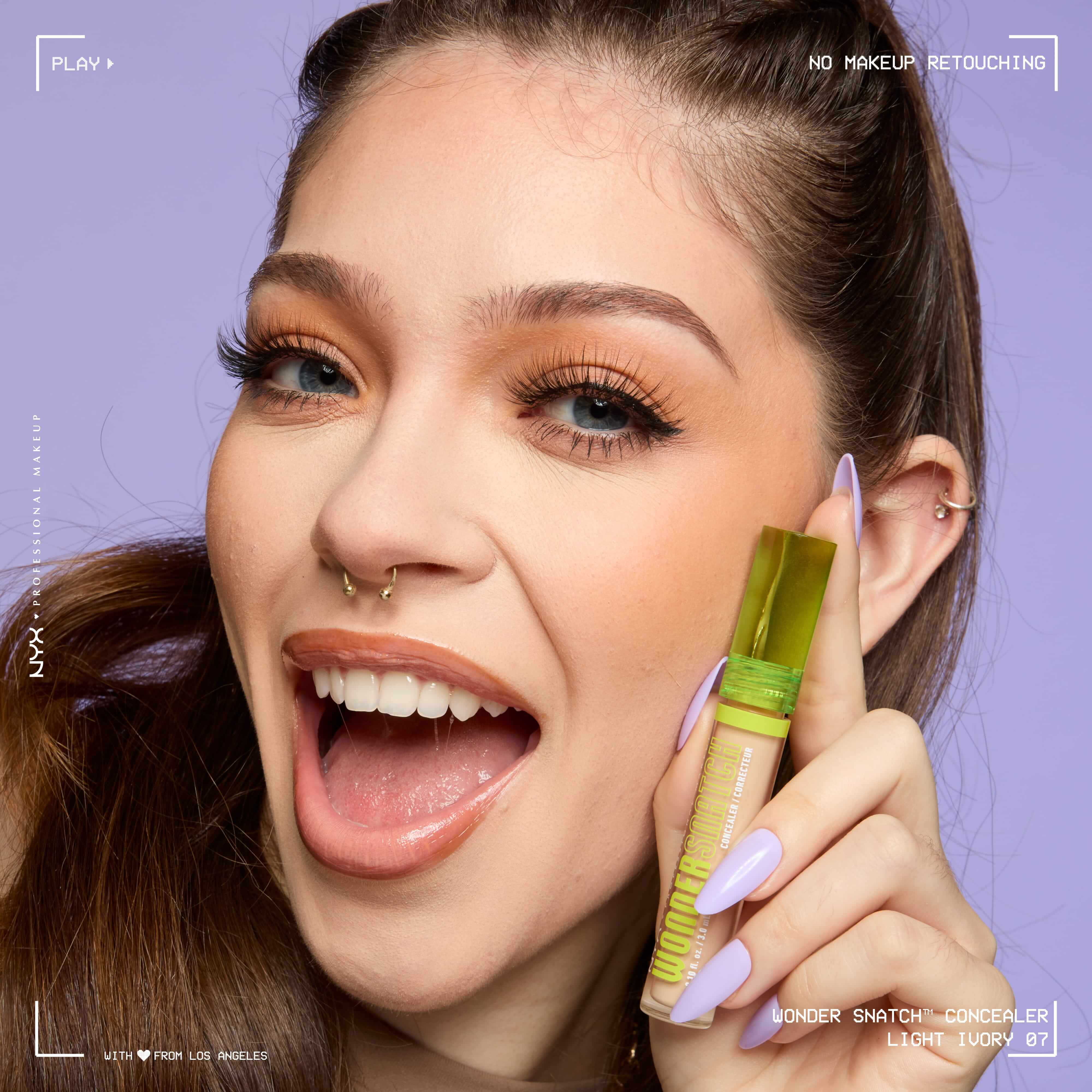 Close-up of model wearing Wonder Snatch(TM) Concealer, with brightened under-eyes, smooth-looking skin, and a natural finish.
