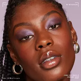 A NYX Cosmetics model wearing mauve eyeshadow and glossy lipstick. 