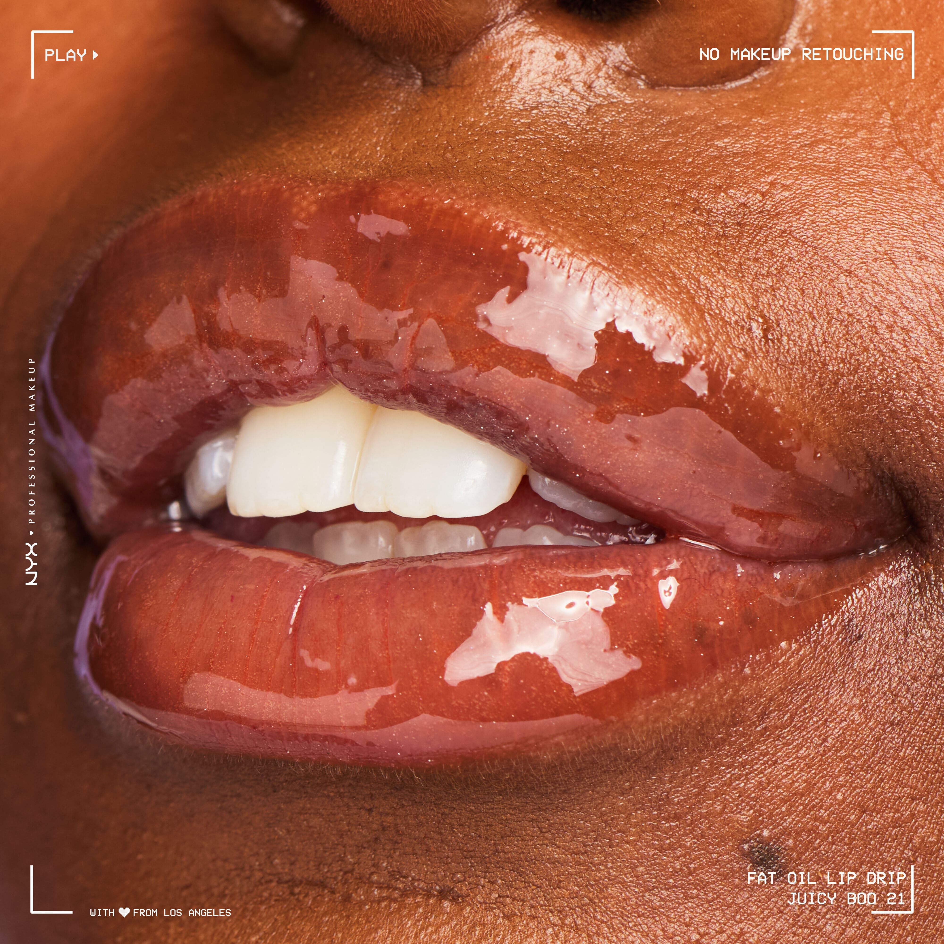 Close-up of glossy lips on deep skin tone wearing NYX Professional Makeup Fat Oil Lip Drip in Juicy Boo, showing rich shine, smooth hydration, and natural lip texture without retouching.