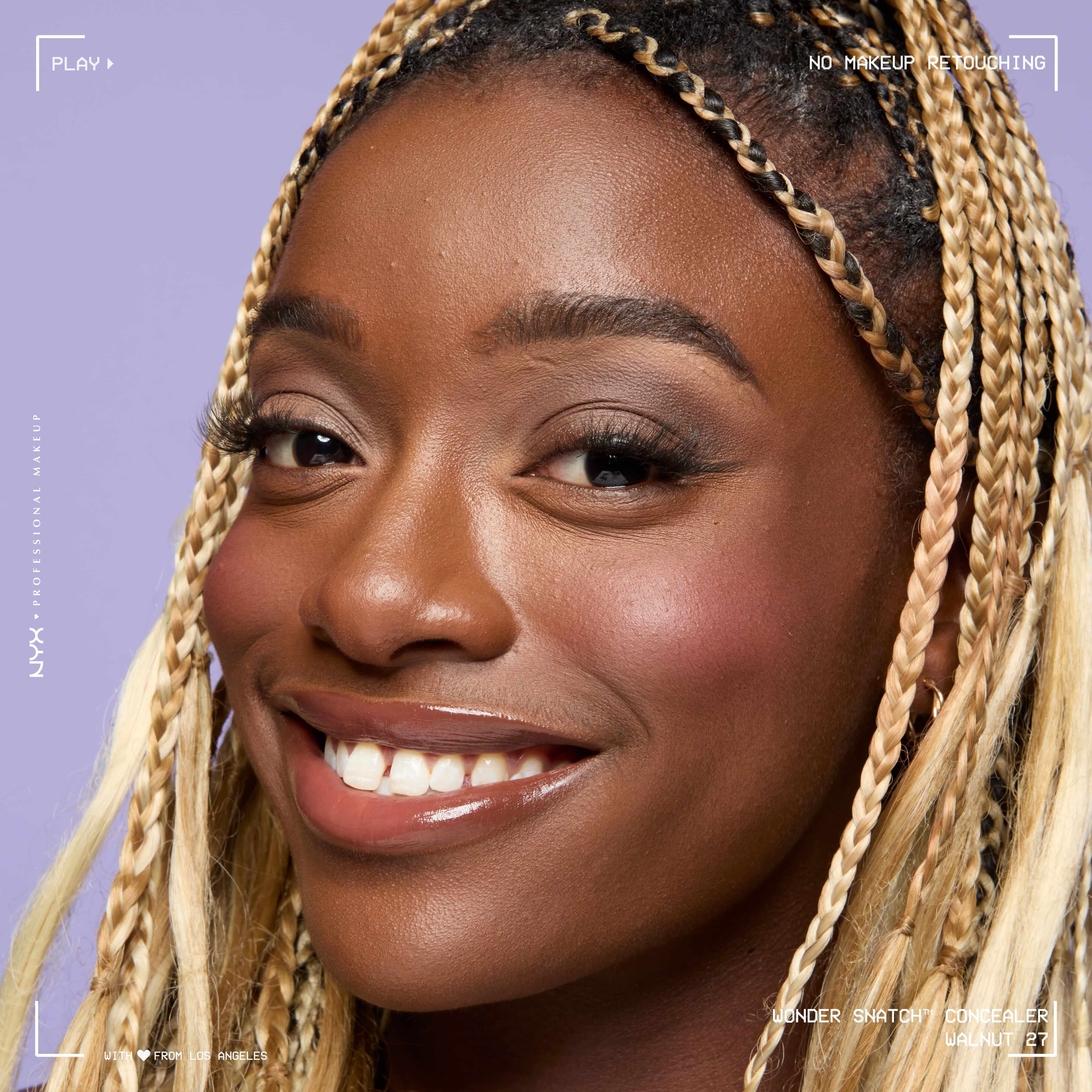 Close-up of model wearing Wonder Snatch(TM) Concealer, with brightened under-eyes, smooth-looking skin, and a natural finish.