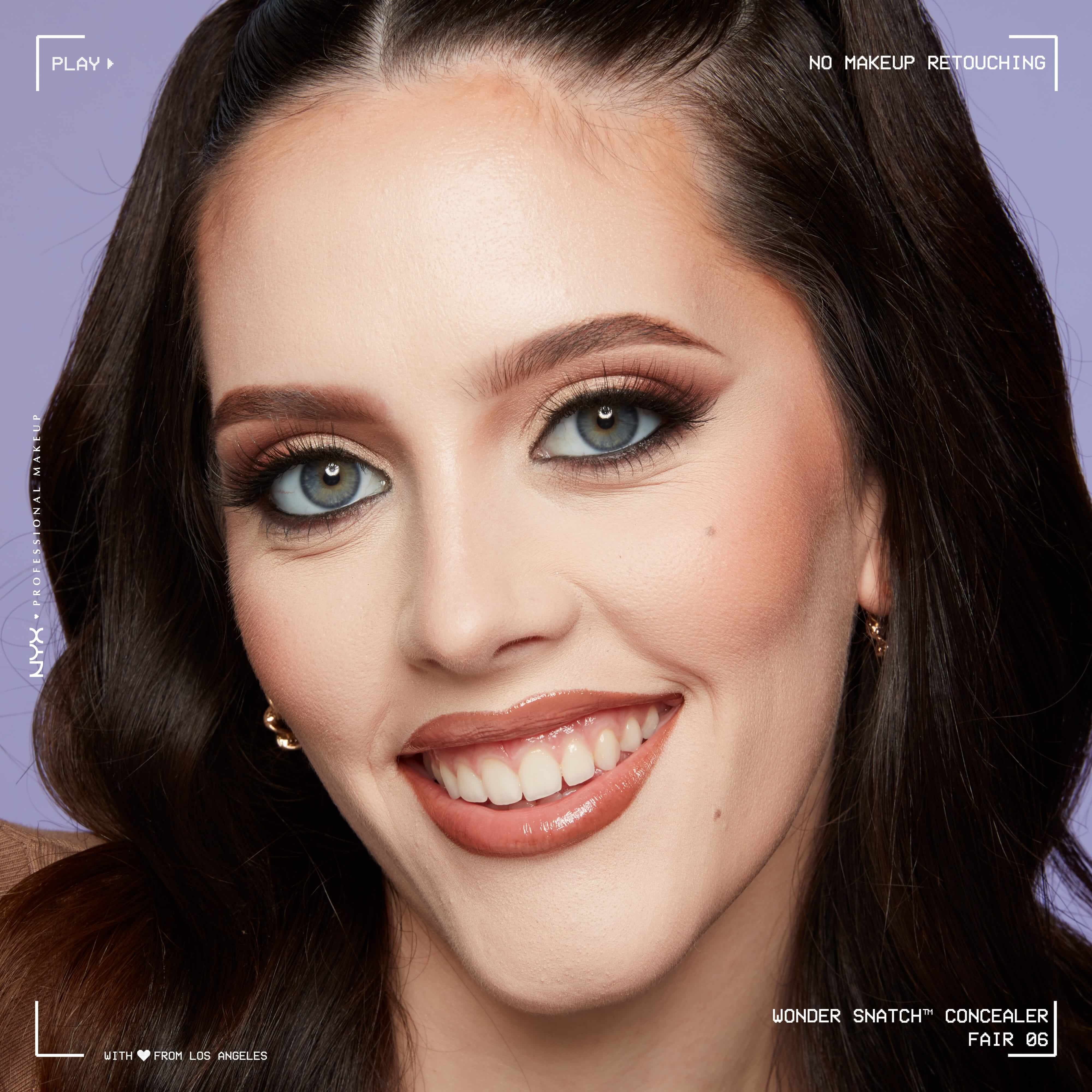 Close-up of model wearing Wonder Snatch(TM) Concealer, with brightened under-eyes, smooth-looking skin, and a natural finish.