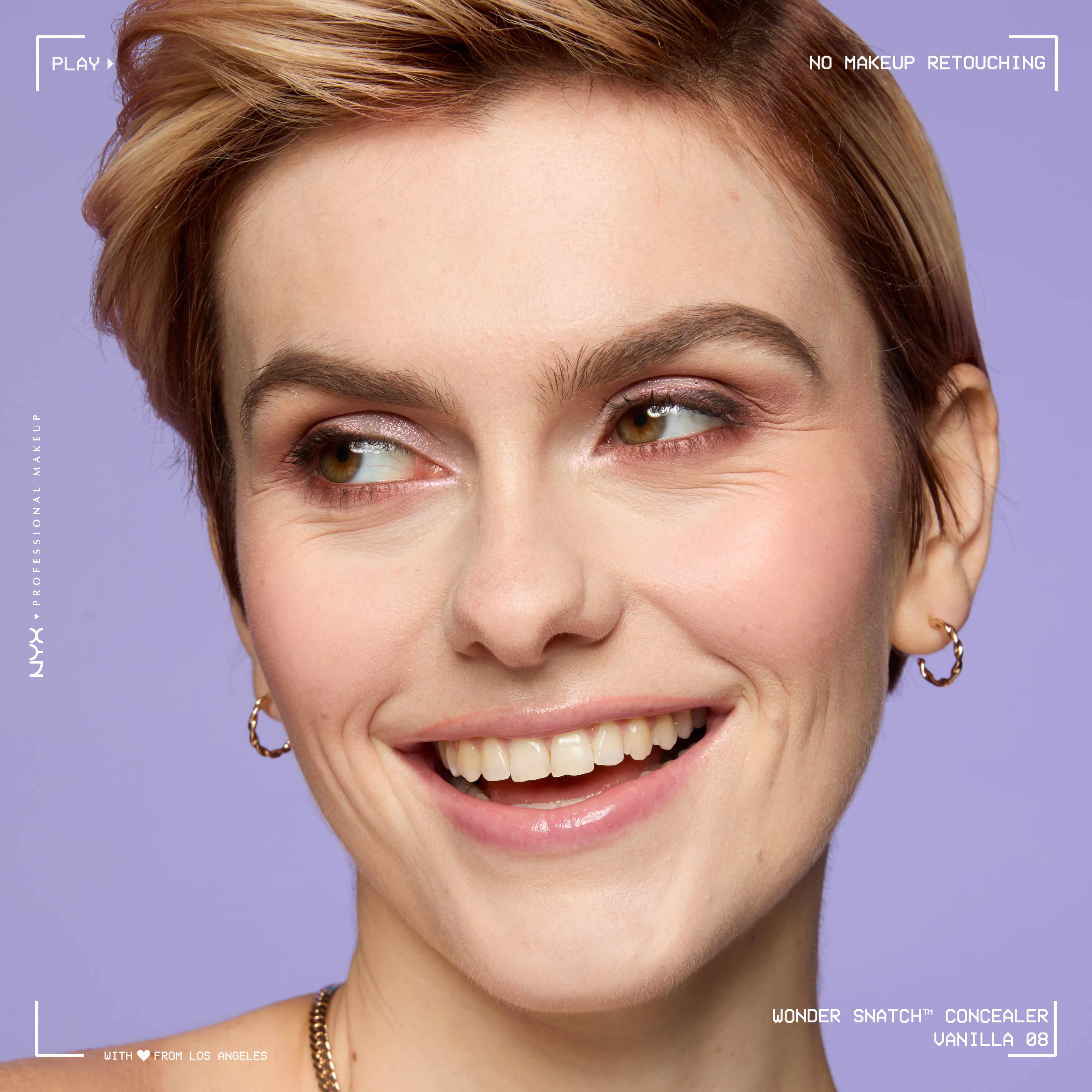 Close-up of model wearing Wonder Snatch(TM) Concealer, with brightened under-eyes, smooth-looking skin, and a natural finish.