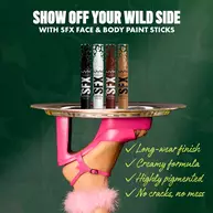 NYX Professional Makeup Party Animals SFX Face & Body Paint Sticks displayed on a tray held by a model wearing pink gloves.