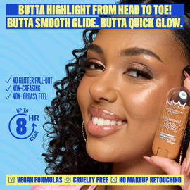 Model with glowing bronze skin holding NYX Buttermelt Stix, smooth radiant finish