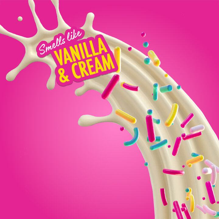 Splash of cream-colored liquid with colorful sprinkles and "Smells like Vanilla & Cream" text on a pink background, representing NYX Professional Makeup Suga Baddie fragrance.