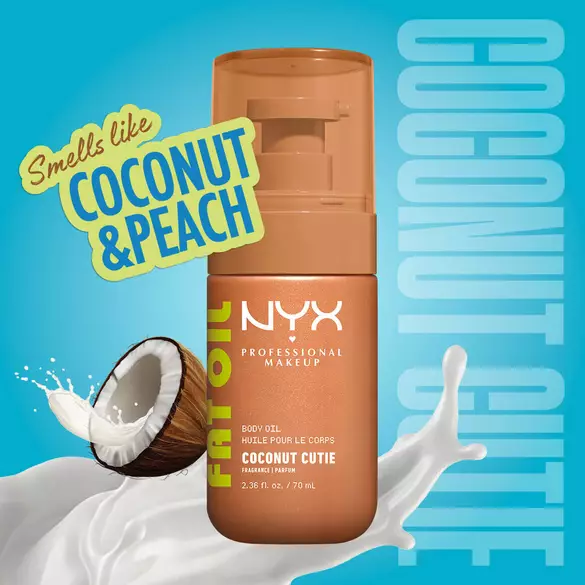 NYX Professional Makeup Fat Oil Body Oil in Coconut Cutie scent, bronze bottle, with a coconut and splashing milk, labeled as smelling like coconut and peach, on a blue background.
