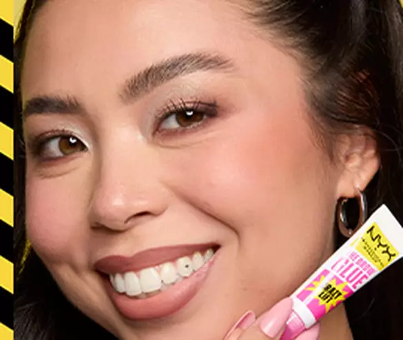 Model with lifted and laminated brows smiling and posing with The Brow Glue Crazy Lift