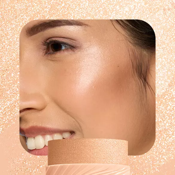 Model with champagne highlight wearing NYX Buttermelt Stix in A Whole Melt 06 showing radiant golden shimmer
