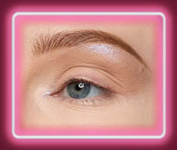 Close-up of an eye with NYX Professional Makeup Lid Lingerie Cream Eye Pigment in 10 Lacy Lilac applied to the inner corner and brow bone.
