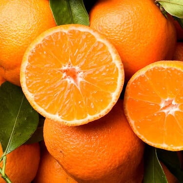 NYX Professional Makeup Juicy Boo Hair & Body Fragrance Mist scent top notes are of halved clementines and whole oranges representing top notes of juicy clementine, mango pulp, and golden berries.