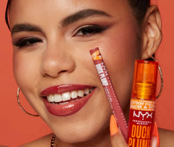 woman posing with Duck Plump Plumping Lip Liner and Duck Plump Lip Plumping Gloss