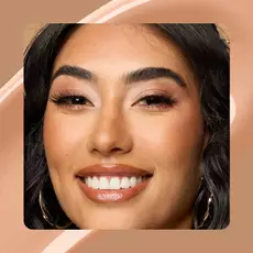 Close-up of model wearing Wonder Snatch(TM) Concealer in Shade 14 Medium Olive.