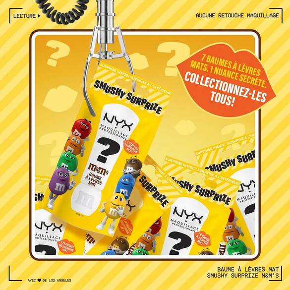NYX Professional Makeup M&M’S Smushy Surprize Matte Lip Balm packaging in a claw machine setting, surrounded by colorful M&M’S characters and a callout promoting 7 collectible lip balms, 1 rare. Yellow striped background.